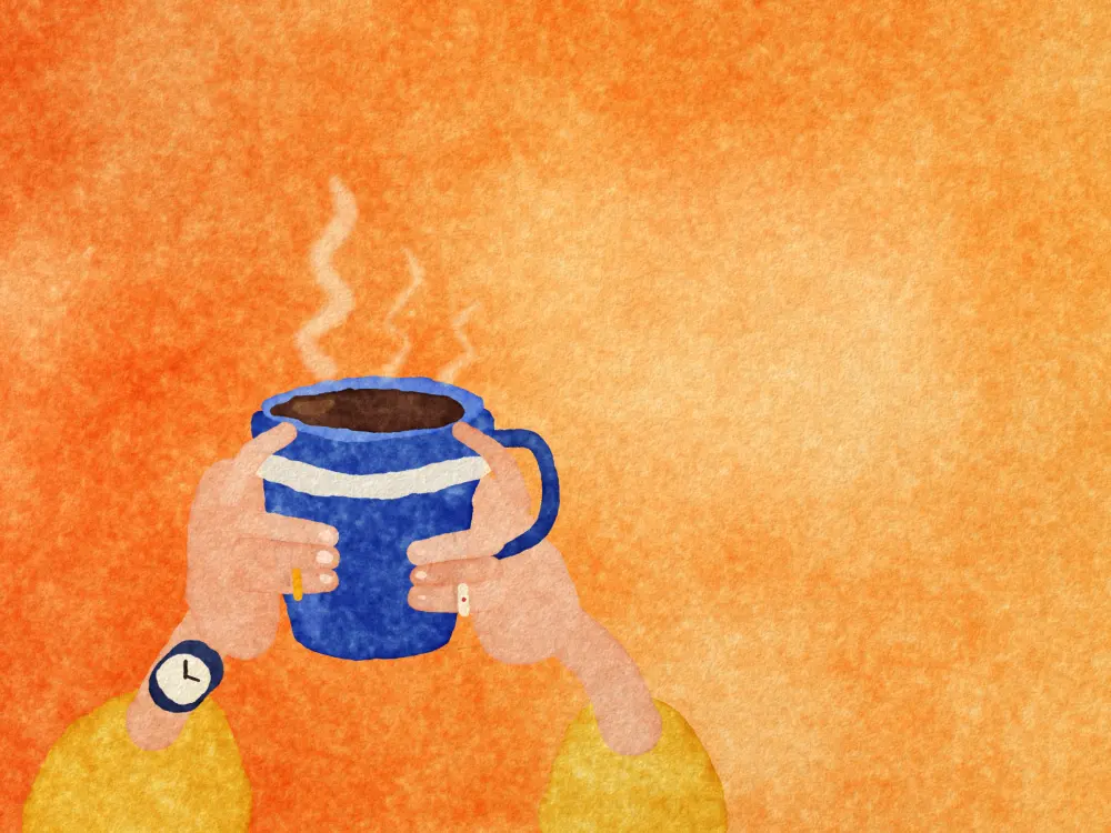 Two hands with rings and a watch holding a steaming blue mug.