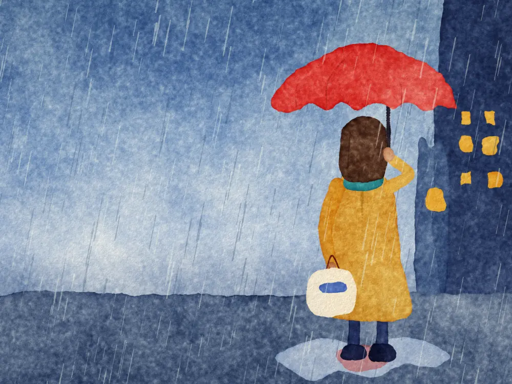 A woman under a red umbrella in the rain.